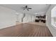 Open-concept living space with wood-look flooring that opens into a kitchen with modern appliances at 2522 Dalmahoy Ln, Fuquay Varina, NC 27526