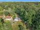 Aerial view of a home surrounded by mature trees and a well maintained lawn at 2608 Foxgate Dr, Raleigh, NC 27610