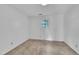 Neutral carpet and a single window brighten this simple bedroom space at 2608 Foxgate Dr, Raleigh, NC 27610