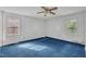 Bright bedroom featuring two windows and carpet floors at 2608 Foxgate Dr, Raleigh, NC 27610