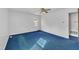 Bedroom with blue carpet, white walls, and a ceiling fan at 2608 Foxgate Dr, Raleigh, NC 27610
