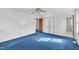 Bedroom with blue carpet, white walls, a ceiling fan, and closet at 2608 Foxgate Dr, Raleigh, NC 27610