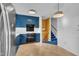 Cozy kitchen features blue cabinetry, white countertops, and black appliances at 2608 Foxgate Dr, Raleigh, NC 27610