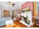 Charming bedroom featuring a decorative fireplace, hardwood floors, and comfortable furnishings for relaxation at 302 Villa St, Rocky Mount, NC 27804