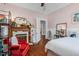 Charming bedroom featuring hardwood floors, a decorative fireplace, and natural light at 302 Villa St, Rocky Mount, NC 27804
