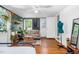 Bedroom with green walls, hardwood floors, a comfortable couch, and plenty of natural light at 302 Villa St, Rocky Mount, NC 27804