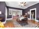 Formal dining room with seating for six, accented by a patterned rug and hardwood floors at 302 Villa St, Rocky Mount, NC 27804
