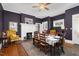 Dining room with wood-burning stove and a large area rug on wood flooring at 302 Villa St, Rocky Mount, NC 27804
