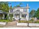 Charming two-story home featuring a welcoming front porch and well-maintained landscaped yard at 302 Villa St, Rocky Mount, NC 27804