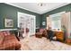 Inviting home office featuring a wooden desk, plush seating, and ample natural light at 302 Villa St, Rocky Mount, NC 27804