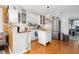 Bright, open kitchen with white cabinetry, butcher block countertops, and stainless steel appliances at 302 Villa St, Rocky Mount, NC 27804