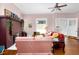 Bright living room featuring a brick fireplace, hardwood floors, and a cozy atmosphere at 302 Villa St, Rocky Mount, NC 27804