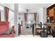 Inviting living room with brick fireplace, a ceiling fan, and multiple seating options at 302 Villa St, Rocky Mount, NC 27804