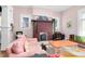 Cozy living room with a brick fireplace, hardwood floors, and comfortable seating at 302 Villa St, Rocky Mount, NC 27804
