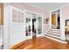 Elegant living area with hardwood floors, glass doors, and staircase at 302 Villa St, Rocky Mount, NC 27804