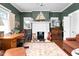 Well-appointed office with desk, chair, rug, and decor at 302 Villa St, Rocky Mount, NC 27804