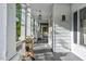 Inviting front porch featuring decorative plants, white columns, and a pendant light at 302 Villa St, Rocky Mount, NC 27804