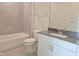Bathroom features gray tiled walls, tub, white vanity with dark countertop and chrome fixtures at 3026 Freewinds Way # 50, Cary, NC 27519