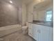 Bathroom featuring a tiled shower and bathtub at 3026 Freewinds Way # 50, Cary, NC 27519