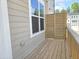 This outdoor deck features wood slats, siding, and bright white window trim at 3026 Freewinds Way # 50, Cary, NC 27519