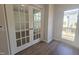 Office space with hardwood floors, window and glass paneled french doors at 3026 Freewinds Way # 50, Cary, NC 27519