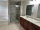 Bathroom featuring a walk-in shower with glass doors and a double vanity with a granite countertop at 3032 Kilarney Ridge Loop, Cary, NC 27511