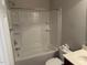 Bathroom with a shower-tub combination, white fixtures, and chrome hardware at 3032 Kilarney Ridge Loop, Cary, NC 27511