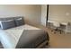 Bedroom with gray accents, featuring a desk and chair perfect for a home office setup at 3032 Kilarney Ridge Loop, Cary, NC 27511