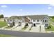 Modern townhomes showcase varied facades, each with a one-car garage and well-manicured lawns at 31 Hyacinth Ln # 165, Angier, NC 27501