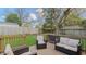 A furnished back deck overlooks a spacious backyard at 311 Oakley St, Graham, NC 27253