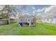 Large backyard showcasing a deck with ample space, perfect for outdoor activities at 311 Oakley St, Graham, NC 27253