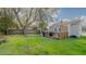 Spacious backyard with a wooden deck, ideal for outdoor entertaining and relaxation at 311 Oakley St, Graham, NC 27253