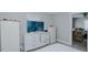 Cozy bedroom with a TV, storage, and a doorway that leads to an adjacent living room at 311 Oakley St, Graham, NC 27253