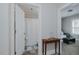 Hallway view leading to a bathroom and living room, enhancing spaciousness and flow at 311 Oakley St, Graham, NC 27253