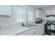 This kitchen features light countertops, ample cabinetry, and stainless appliances at 311 Oakley St, Graham, NC 27253