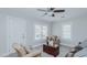 Inviting living room featuring a wooden chest, floral chair, natural light and a neutral color palette at 311 Oakley St, Graham, NC 27253