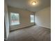 Cozy bedroom with plush carpeting and natural light from two bright windows at 322 Deodora Ln, Cameron, NC 28326