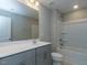 Well-lit bathroom with a gray vanity, white countertop, and a shower-tub combination at 33 Brooklynn Trail # 181, Angier, NC 27501