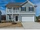 Charming two-story home with a welcoming front porch and a two-car garage at 33 Brooklynn Trail # 181, Angier, NC 27501