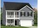 Charming two-story home with a gray exterior, white trim, a two-car garage, and double porches at 33 Brooklynn Trail # 181, Angier, NC 27501