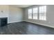 Spacious living room with fireplace and large windows at 33 Brooklynn Trail # 181, Angier, NC 27501