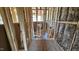 Bathroom plumbing and framing in unfinished room, with insulation and pipes at 3918 Well Fleet Dr, Fuquay Varina, NC 27526