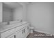 Bathroom featuring a double sink vanity, large mirror, and ample counter space at 3918 Well Fleet Dr, Fuquay Varina, NC 27526