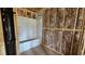 Bathroom featuring framing, new tub, and insulation, ready for finishing touches at 3918 Well Fleet Dr, Fuquay Varina, NC 27526