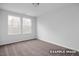Bright bedroom with neutral carpet and two large windows providing natural light at 3918 Well Fleet Dr, Fuquay Varina, NC 27526