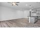 Spacious living room view showcasing open layout and seamless flow into the adjacent kitchen at 3918 Well Fleet Dr, Fuquay Varina, NC 27526