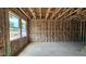 Bright living room with large windows, exposed framing, and insulation for comfortable living at 3918 Well Fleet Dr, Fuquay Varina, NC 27526