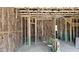 Interior view showcasing framing, insulation, and plumbing in unfinished room at 3918 Well Fleet Dr, Fuquay Varina, NC 27526
