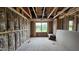 Framed room featuring natural light, exposed beams, and insulation for energy efficiency at 3918 Well Fleet Dr, Fuquay Varina, NC 27526