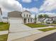 Charming home with an attached garage, new landscaping, and long concrete driveway at 392 Peach Grove Way, Lillington, NC 27546